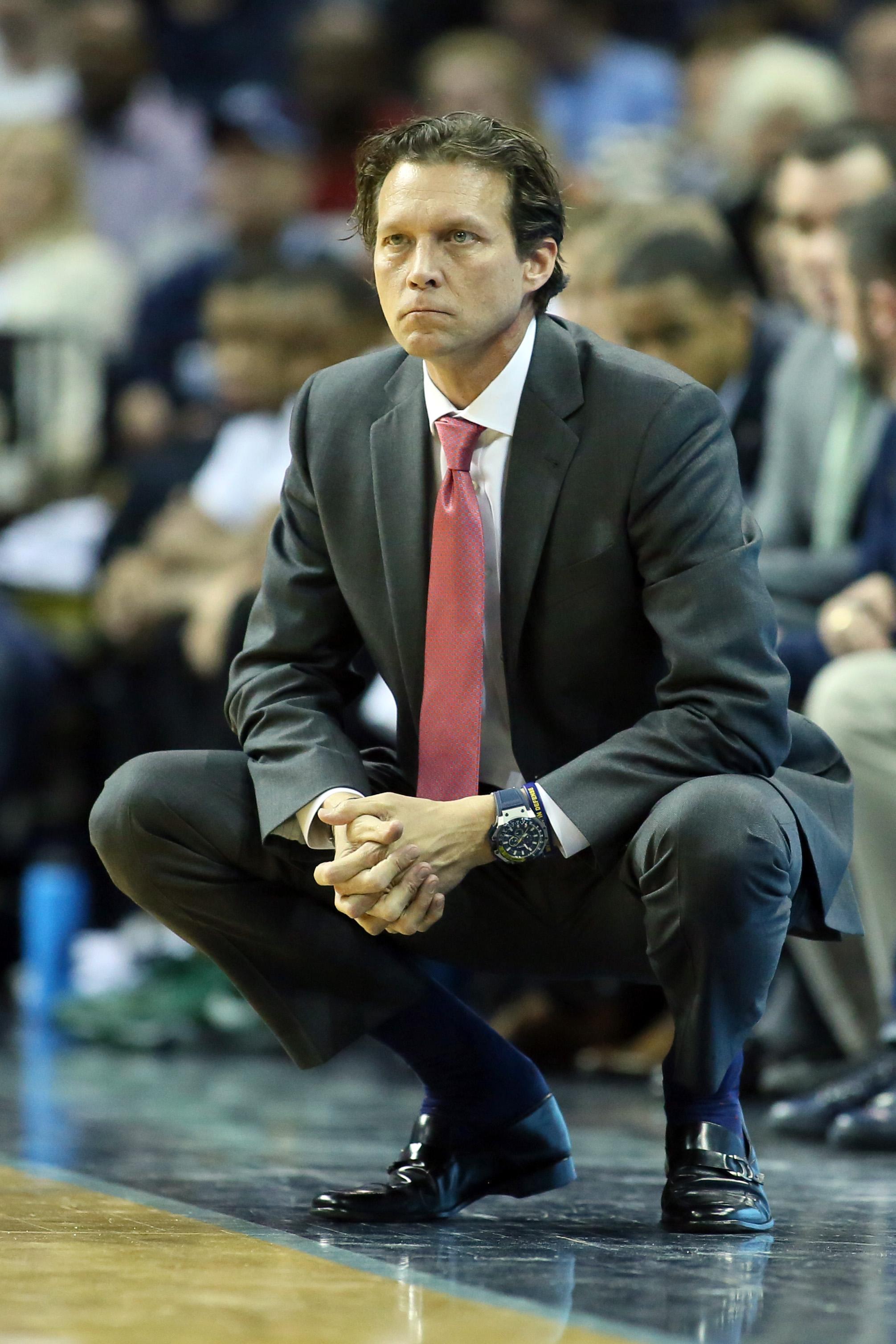 Atlanta Hawks head coach Quin Snyder looks at his notes during the