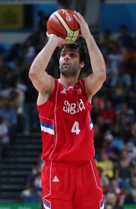 Aug 19, 2016; Rio de Janeiro, Brazil; Serbia point guard Milos Teodosic (4) shoots the ball against Australia power forward Aron Baynes (12) during the men's basketball semifinal in the Rio 2016 Summer Olympic Games at Carioca Arena 1. Mandatory Credit: Jeff Swinger-USA TODAY Sports