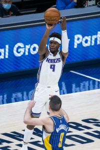 Sacramento Kings guard Terence Davis defends against New York