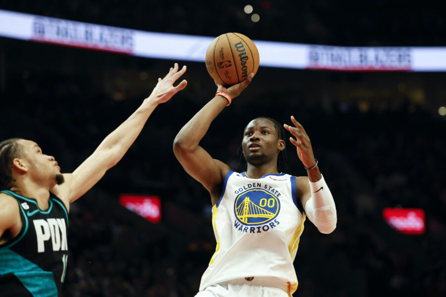 FILE - Golden State Warriors forward Jonathan Kuminga stands on